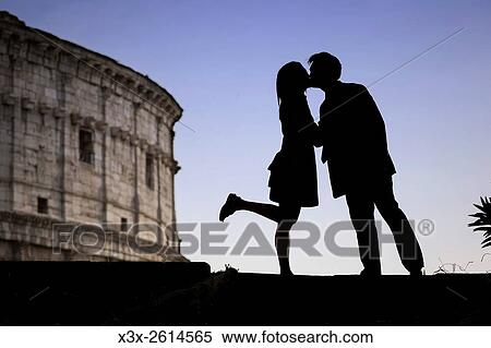 Couple kissing at the Roman Colosseum in Rome Italy. View Large Photo Image Stock Photography - Couple kissing at the Roman Colosseum in Rome Italy.. Fotosearch