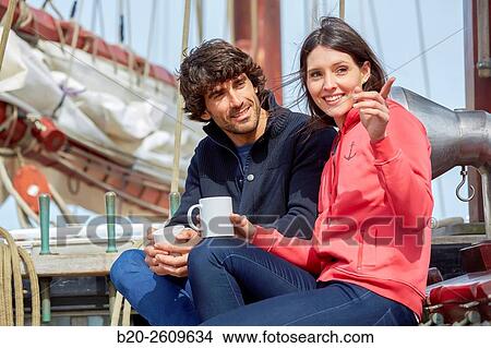 Couple outside a sailboat, galleon. Masts. Basque Country. Spain View Large Photo Image Picture - Couple outside a sailboat, galleon. Masts. Basque Country. Spain. Fotosearch