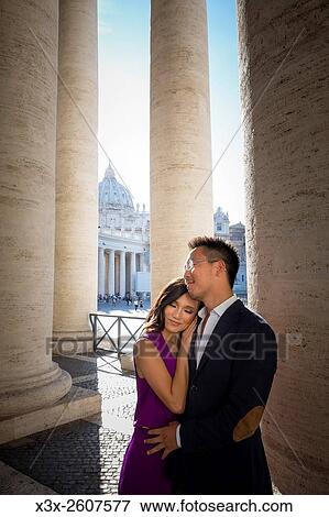 Couple under the columns of Saint Peters square. In the Vatican. Rome, Italy. View Large Photo Image Stock Photo - Couple under the columns of Saint Peters square. In the Vatican. Rome, Italy.. Fotosearch