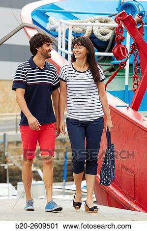 Couple walking in the fishing port. Getaria. Gipuzkoa. Basque Country. Spain View Large Photo Image Stock Image - Couple walking in the fishing port. Getaria. Gipuzkoa. Basque Country. Spain. Fotosearch