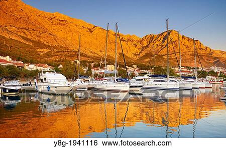 Stock Photograph - Croatia - Makarska Riviera, harbor in the Baska Voda village, Dalmatia, Croatia.. Fotosearch