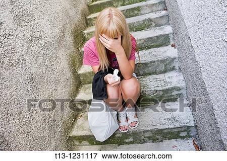 Crying with a paper handkerchief in her hand View Large Photo Image Stock Photo - Crying with a paper handkerchief in her hand. Fotosearch