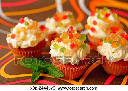 Stock Photo - Cupcakes with candied fruit.. Fotosearch