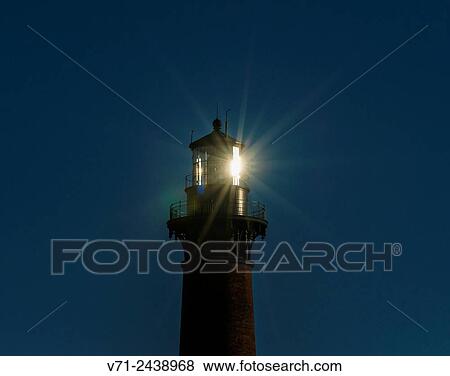 Stock Photo - Currituck Beach Lighthouse with Morning Sunlight Reflected.. Fotosearch
