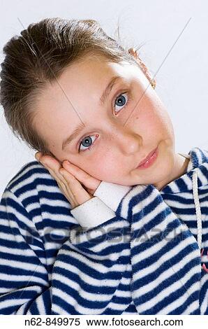Stock Photography - Cute girl sleeping and that he puts his hands near the face. Fotosearch