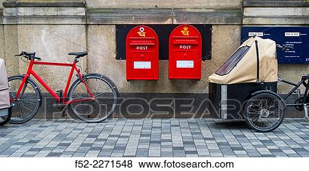 Stock Photo - Denmark, Copenhagen, Bicycle and mailbox. Fotosearch
