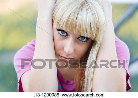 Stock Photography - depressed young woman portrait. Fotosearch
