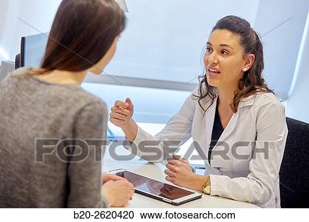 Doctor attending to patient medical consultation. Office. View Large Photo Image Stock Image - Doctor attending to patient medical consultation. Office.. Fotosearch