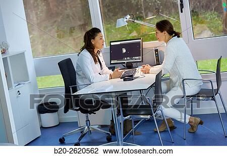 Doctor attending to patient medical consultation. Office. Plastic surgery. View Large Photo Image Stock Image - Doctor attending to patient medical consultation. Office. Plastic surgery.. Fotosearch
