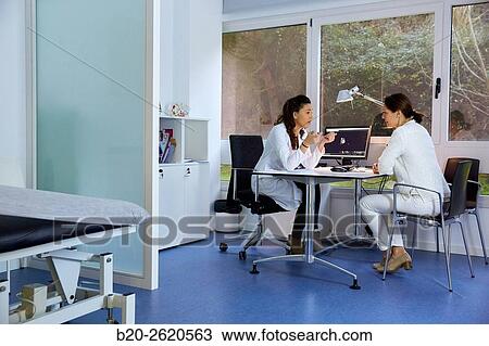 Doctor attending to patient medical consultation. Office. Plastic surgery. View Large Photo Image Stock Image - Doctor attending to patient medical consultation. Office. Plastic surgery.. Fotosearch