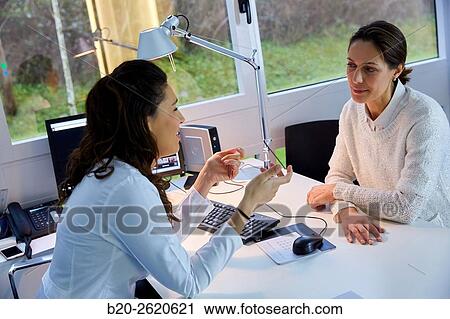 Doctor attending to patient medical consultation. Office. Plastic surgery. View Large Photo Image Stock Image - Doctor attending to patient medical consultation. Office. Plastic surgery.. Fotosearch
