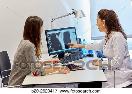 Doctor attending to patient medical consultation. Office. View Large Photo Image Stock Photo - Doctor attending to patient medical consultation. Office.. Fotosearch
