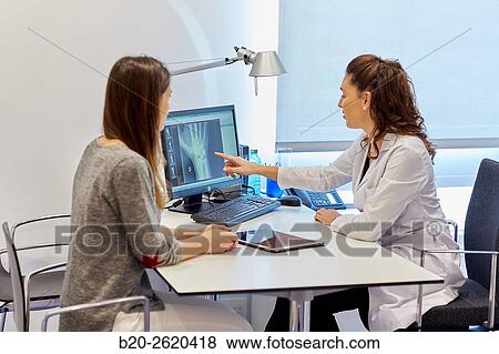 Doctor attending to patient medical consultation. Office. View Large Photo Image Stock Photo - Doctor attending to patient medical consultation. Office.. Fotosearch