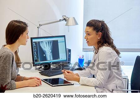 Doctor attending to patient medical consultation. Office. View Large Photo Image Stock Photo - Doctor attending to patient medical consultation. Office.. Fotosearch