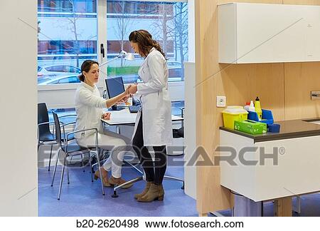 Doctor attending to patient medical consultation. Office. Plastic surgery. View Large Photo Image Stock Photo - Doctor attending to patient medical consultation. Office. Plastic surgery.. Fotosearch