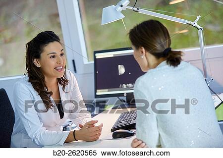 Doctor attending to patient medical consultation. Office. Plastic surgery. View Large Photo Image Stock Photography - Doctor attending to patient medical consultation. Office. Plastic surgery.. Fotosearch