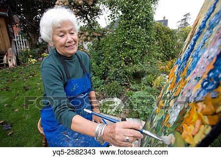 elderly artist painting in garden. View Large Photo Image Stock Image - elderly artist painting in garden.. Fotosearch