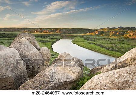 Eroded sandstone hoodoos and rock formations along the Milk River, Writing on Stone Provincial Park Alberta Canada. View Large Photo Image Stock Photo - Eroded sandstone hoodoos and rock formations along the Milk River, Writing on Stone Provincial Park Alberta Canada.. Fotosearch