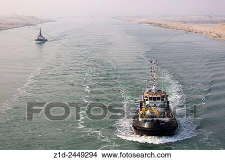 Picture - Escort tugs for very large passenger ship transiting the Suez Canal. Egypt.. Fotosearch