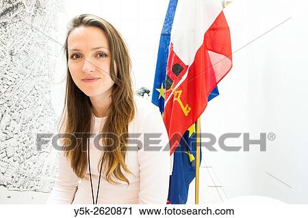 EuroEuropean Parliament, Brussels, Belgium. Young, attractive brunette sitting in front of her Gibraltar country flags inside the Parliament building. View Large Photo Image Stock Image - EuroEuropean Parliament, Brussels, Belgium. Young, attractive brunette sitting in front of her Gibraltar country flags inside the Parliament building.. Fotosearch