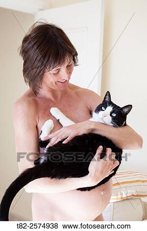 European woman pregnant with a black and white cat in her arms View Large Photo Image Stock Photo - European woman pregnant with a black and white cat in her arms. Fotosearch