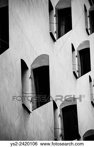 Stock Photograph - Facade of old building with metal window shutters in Gamla Stan (Old Town) Stockholm, Sweden.. Fotosearch