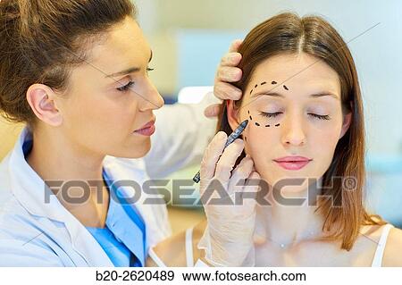 Facelift. Blepharoplasty. Surgery that aims to rejuvenate the look. It is to remove excess skin and bags of both eyelids and periocular tissue remodeling. Plastic surgery. Doctor attending to patient medical consultation. View Large Photo Image Stock Photo - Facelift. Blepharoplasty. Surgery that aims to rejuvenate the look. It is to remove excess skin and bags of both eyelids and periocular tissue remodeling. Plastic surgery. Doctor attending to patient medical consultation.. Fotosearch