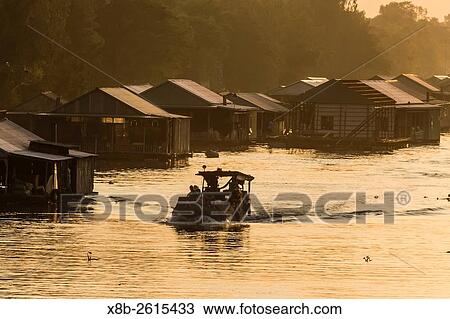 Family river life on the manmade Tan Chau Canal, near Chau Doc, Vietnam. View Large Photo Image Stock Image - Family river life on the manmade Tan Chau Canal, near Chau Doc, Vietnam.. Fotosearch