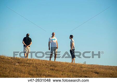 Stock Photo - Family walking in the Sculpture park of the Tower of Hercules, A Corua, Galicia, Spain, Europe. Fotosearch
