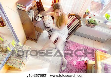 Fanciful young woman with box, artistic color View Large Photo Image Stock Image - Fanciful young woman with box, artistic color. Fotosearch