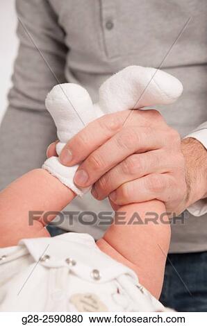 Father about to change his baby boy's nappy View Large Photo Image Stock Image - Father about to change his baby boy's nappy. Fotosearch