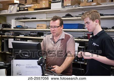 Father is training his son in computer repair shop View Large Photo Image Stock Photograph - Father is training his son in computer repair shop. Fotosearch
