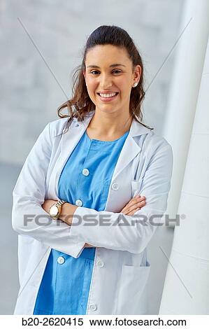 Stock Photography - Female Doctor, looking at camera, Plastic Surgeon. Fotosearch