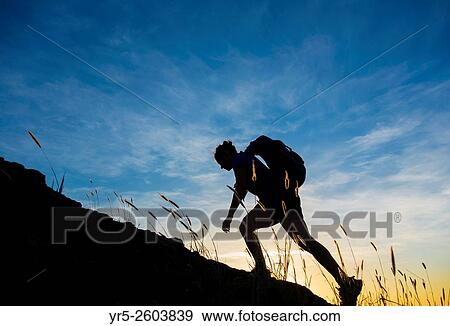 Female hiker on volcanic mountain overlooking Las Palmas city. La Isleta, Las Palmas, Gran Canaria, Canary Islands, Spain. View Large Photo Image Stock Photo - Female hiker on volcanic mountain overlooking Las Palmas city. La Isleta, Las Palmas, Gran Canaria, Canary Islands, Spain.. Fotosearch