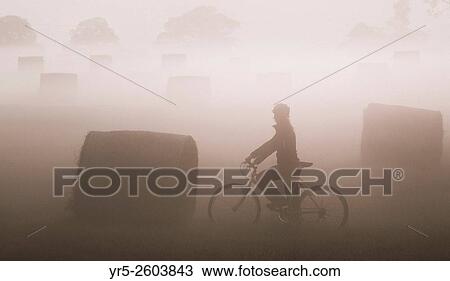 Female mountain biker near Hay bales at sunrise in early morning mist near Billingham, north east England, United Kingdom. United Kingdom. View Large Photo Image Stock Image - Female mountain biker near Hay bales at sunrise in early morning mist near Billingham, north east England, United Kingdom. United Kingdom.. Fotosearch