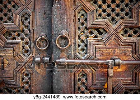 Fez. Historic wooden door in old house, Medina. Detail of the decorative ornament. Morocco. View Large Photo Image Stock Photo - Fez. Historic wooden door in old house, Medina. Detail of the decorative ornament. Morocco.. Fotosearch