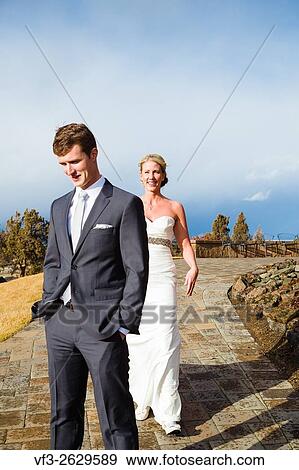 First look moment at a wedding before the ceremony starts in Central Oregon. View Large Photo Image Stock Photo - First look moment at a wedding before the ceremony starts in Central Oregon.. Fotosearch