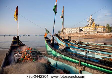 fishing boats at the beach in front of the Murudeshwar temple, Murudeshwar, Karnataka, India, Asia. View Large Photo Image Picture - fishing boats at the beach in front of the Murudeshwar temple, Murudeshwar, Karnataka, India, Asia.. Fotosearch