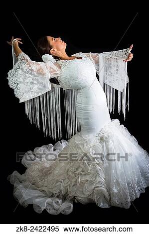 Flamenco dancer dressed in white with expression of feeling passionate in black background. View Large Photo Image Stock Photography - Flamenco dancer dressed in white with expression of feeling passionate in black background.. Fotosearch