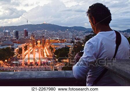 Font Mgica with city skyline, Tibidabo Mountain and Serra de Collserola in background, Barcelona, Catalonia, Spain. View Large Photo Image Stock Image - Font Mgica with city skyline, Tibidabo Mountain and Serra de Collserola in background, Barcelona, Catalonia, Spain.. Fotosearch