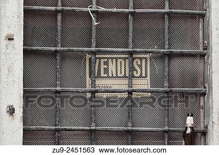 Stock Image - For sale sign behind a grill in the Castello district, Venice, Veneto, Italy, Europe.. Fotosearch