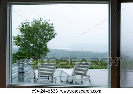 Garden furniture as seen through large windows, looking out with raindrops on the glass. Pittsburgh Pennsylvania USA View Large Photo Image Stock Image - Garden furniture as seen through large windows, looking out with raindrops on the glass. Pittsburgh Pennsylvania USA. Fotosearch