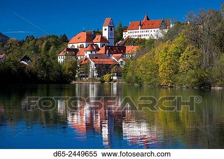 Germany, Bavaria, Fussen, St. Mang Abbey and the Hohes Schloss Castle from the Lech River. View Large Photo Image Stock Photography - Germany, Bavaria, Fussen, St. Mang Abbey and the Hohes Schloss Castle from the Lech River.. Fotosearch