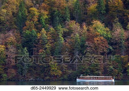 Stock Photo - Germany, Bavaria, Konigsee, electrically powered lake tour boats, fall.. Fotosearch