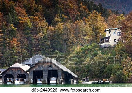 Stock Photograph - Germany, Bavaria, Konigsee, village by Konigsee Lake, lake tour boat garages.. Fotosearch