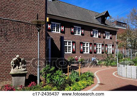 Stock Photo - Germany, Goch, Niers, Lower Rhine, Rhineland, North Rhine-Westphalia, NRW, womens house, retirement home, brick building.. Fotosearch
