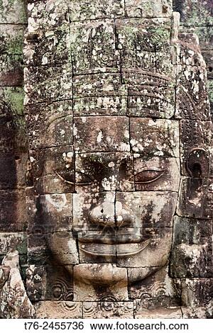 Giant stone face at the Bayon temple at Angkor Wat in Siem Reap, Cambodia. View Large Photo Image Stock Photograph - Giant stone face at the Bayon temple at Angkor Wat in Siem Reap, Cambodia.. Fotosearch