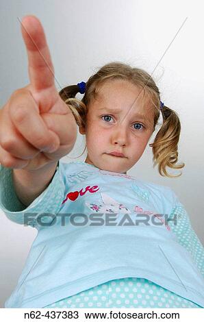 Girl disappointed bottom view indicates with her index finger View Large Photo Image Stock Image - Girl disappointed bottom view indicates with her index finger. Fotosearch