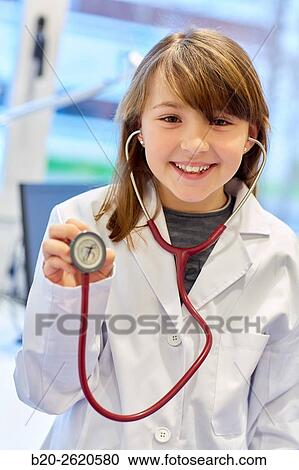 Girl dressed in doctor. Medical consultation. Office. Pediatrician. View Large Photo Image Stock Image - Girl dressed in doctor. Medical consultation. Office. Pediatrician.. Fotosearch