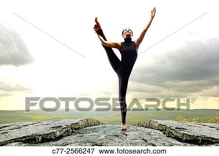 Girl excercising, mountain top View Large Photo Image Stock Photo - Girl excercising, mountain top. Fotosearch
